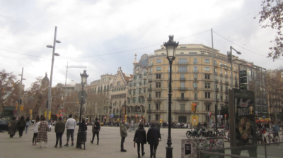 A view of the street in Barcelona, with Casa Battlo in the backgroud. 